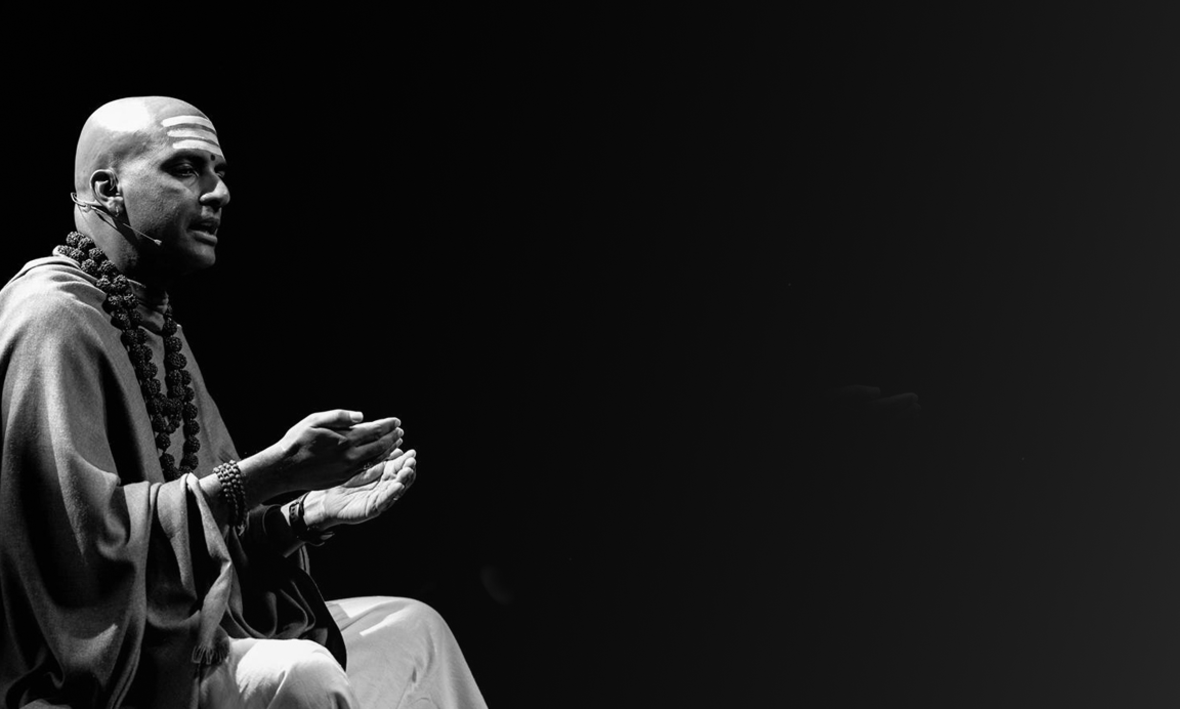 Dandapani is speaking in front of a conference